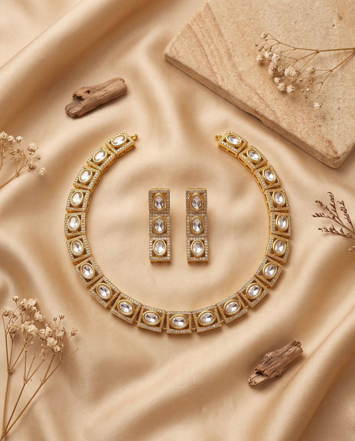 Jadtar Kundan choker necklace with long earrings styled on satin – Studio Gulabi