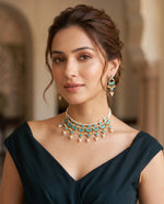 Woman wearing jadtar and moti choker necklace set with green drops and matching earrings – Studio Gulabi