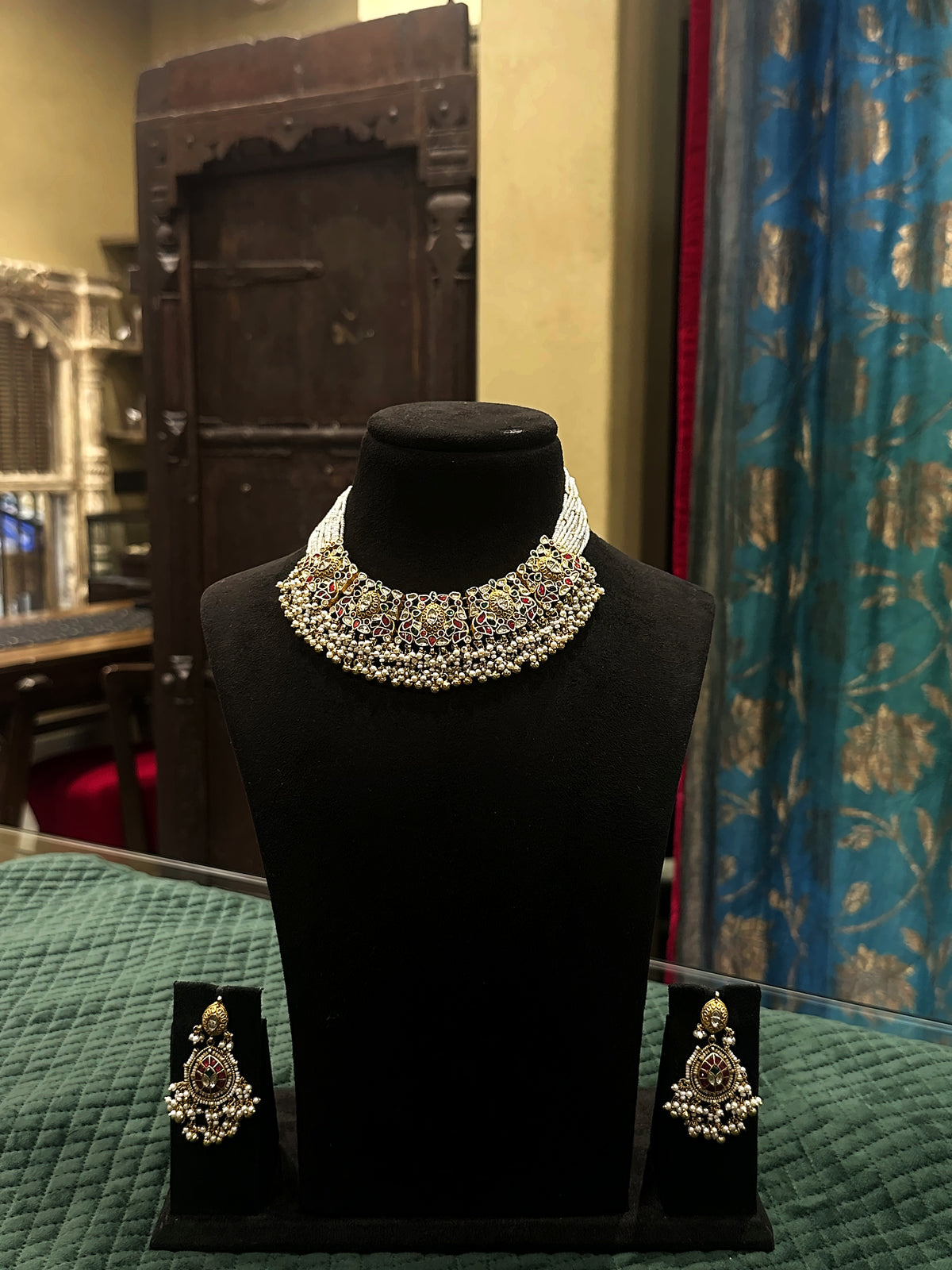 Jadtar multi-strand moti choker necklace with matching earrings on black velvet bust – Studio Gulabi 626VAI027