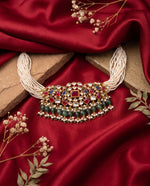 Kundan moti mala choker with ruby and emerald drops and matching earrings styled on satin – Studio Gulabi