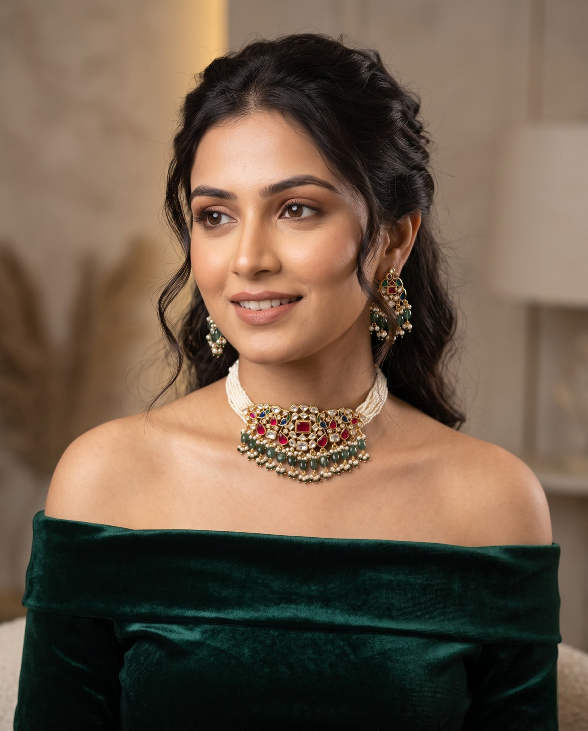 Woman wearing kundan moti mala choker with ruby and emerald drops and matching earrings – Studio Gulabi