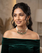 Woman wearing kundan moti mala choker with ruby and emerald drops and matching earrings – Studio Gulabi