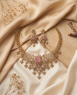 Noor Polki and moti choker set with pink stone and matching earrings styled on satin – Studio Gulabi