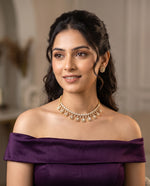 Woman wearing polki and moti necklace set with matching earrings – Studio Gulabi