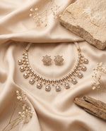 Polki and moti necklace set with matching earrings styled on satin – Studio Gulabi