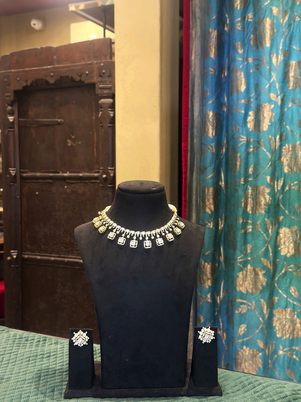 Polki and moti necklace set with matching earrings on black velvet bust – Studio Gulabi 1026VJI079