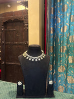 Polki and moti necklace set with matching earrings on black velvet bust – Studio Gulabi 1026VJI079